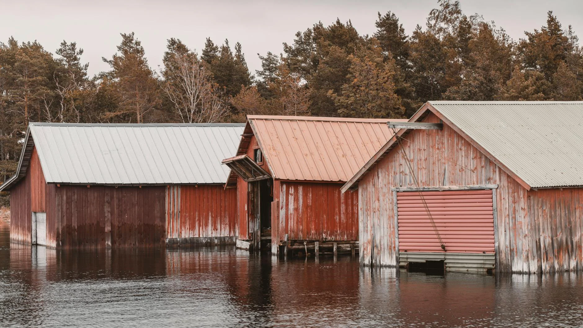The Huon River - tidal, wide, lined with old boat sheds