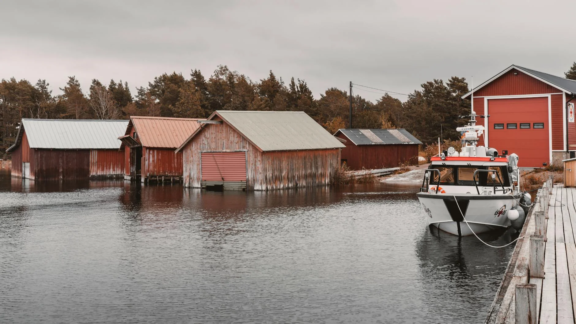 Channel-side boat sheds and timber jetties