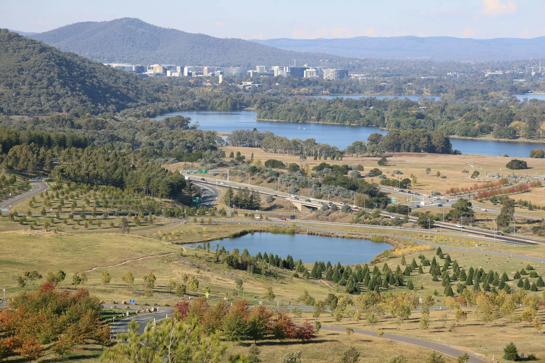 Valley floor road with granite ranges rising on both sides